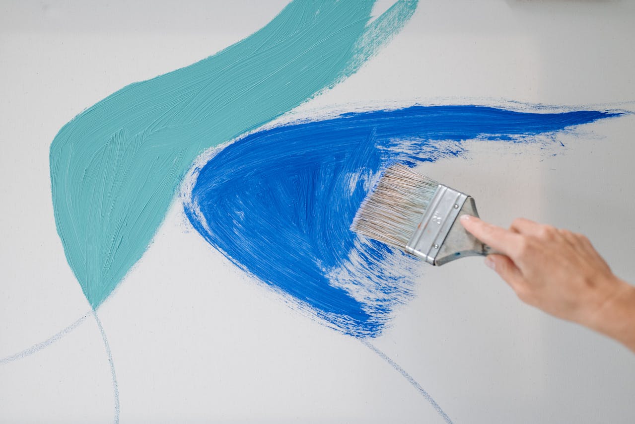 Person Painting White Surface