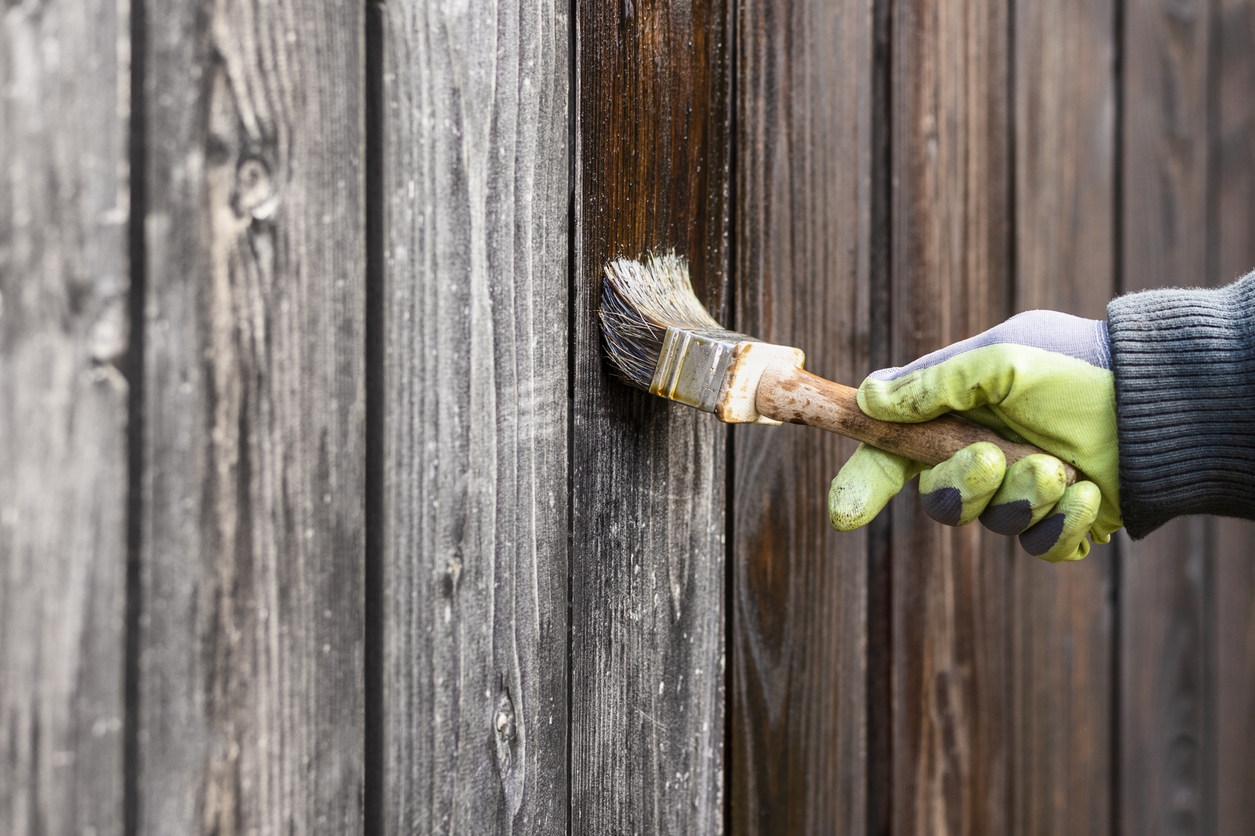 Painting Wood Fence by Oil with Paint Brush